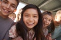 Elementary school kids smiling to camera, close up