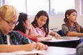 Elementary school kids working at their desks in a classroom Royalty Free Stock Photo