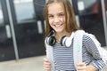 Elementary school pupil outside carrying rucksack Royalty Free Stock Photo