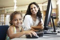 Elementary School Pupil With Teacher In Computer Class