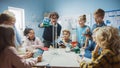 Elementary School Science / Chemistry Classroom: Teacher Shows Chemical Reaction Experiment to Group Royalty Free Stock Photo