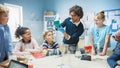 Elementary School Science / Chemistry Classroom: Teacher Shows Chemical Reaction Experiment to Group Royalty Free Stock Photo