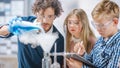 Elementary School Science Classroom: Enthusiastic Teacher Explains Chemistry to Diverse Group of Royalty Free Stock Photo