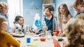 Elementary School Science Classroom: Enthusiastic Teacher Explains Chemistry to Diverse Group of Royalty Free Stock Photo