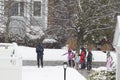 Elementary School Students Accompanied by Parents Waiting School bus in Blizzard Snow Storm in Lexington, MA on January 20, 2023 Royalty Free Stock Photo