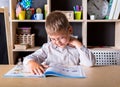 Elementary school. Talented child. Teachers day. School kids. Back to school. Kid is learning in class on background of blackboard Royalty Free Stock Photo