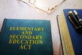Elementary and Secondary Education Act ESEA on a desk.
