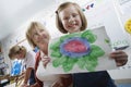 Elementary Student Showing Painting