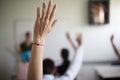 Elementary students raising their arms on a class Royalty Free Stock Photo