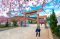 Elementary students in uniforms play in a school yardm