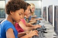 Elementary Students Working At Computers In Classroom Royalty Free Stock Photo