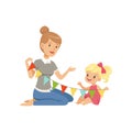 Elementary teacher and little girl sitting on the floor and holding party flags, preschool education concept vector