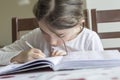 The elementry student is making her homework Royalty Free Stock Photo