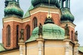 Elements of ancient architecture, statues on wall of the church: Poznan / Poland - September 27, 2020 Royalty Free Stock Photo