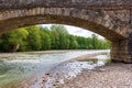 Elements of the bridge construction system and masonry spans across the river. Royalty Free Stock Photo