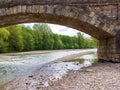 Elements of the bridge construction system and masonry spans across the river. Royalty Free Stock Photo