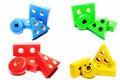 Geometric elements from children`s wooden educational toys grouped by color