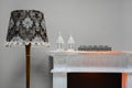 Elements decor. Floor lamp two lamps and glasses on the mantelpiece