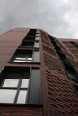 Exterior of a high-rise apartment building facade, windows and balconies. Royalty Free Stock Photo