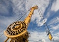 Elements of large mobile construction cranes tower on blue sky Royalty Free Stock Photo