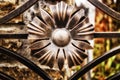 Elements of a metal gate, forged flower