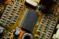 Elements of microcircuits on a green and red board. Microprocessor on the board. Old processor Royalty Free Stock Photo