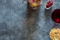 Elements morning breakfast pine nuts cherry jam syrup tea from flower buds red dry rose on a gray stone table background Royalty Free Stock Photo