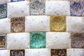 Elements of mosaic fragments Gaudi`s mosaic work in Park Guell In winter in the city of Barcelona. Royalty Free Stock Photo