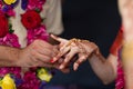 Elements of Vedic wedding wearing rings close up