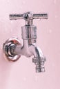 Elements of the water system, water tap to adjust the pressure is covered with water drops vertically photo Royalty Free Stock Photo