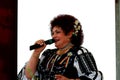Elena Merisoreanu singing on a stage in Italy.