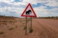 Elephant crossing warning road sign placed in the desert of Namibia Royalty Free Stock Photo