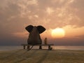 Elephant and dog sit on a beach