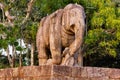 Statue of kneeling war elephant with a man curled in its trunk, Konark Sun Temple, Odisha, India