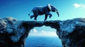 Elephant leaps across a natural rock bridge over the sea Royalty Free Stock Photo