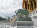 Elephant sculpture at Ruen Yod Barom Mungkalanusaranee pavilion under bright blue sky