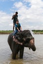 The elephant taking a shower with the tourist and driver in chitwan,Nepal Royalty Free Stock Photo