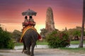 The Elephant for tourist service at Ayutthaya Archeology, Tourists riding elephant in ancient history architecture in Ayutthaya