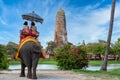 The Elephant for tourist service at Ayutthaya Archeology, Tourists riding elephant in ancient history architecture in Ayutthaya