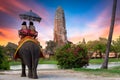 The Elephant for tourist service at Ayutthaya Archeology, Tourists riding elephant in ancient history architecture in Ayutthaya