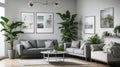 Poster above white cabinet with plant next to grey sofa in simple living room interior. Real photo Royalty Free Stock Photo