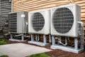 Heating and air conditioning units outside a house. home improvement and climate control Royalty Free Stock Photo