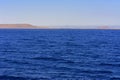 Elevated above sea level, beautiful coral reefs the form mountains and rocks against the blue sky and clear sea water coast of the Royalty Free Stock Photo