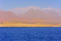 Elevated above sea level, beautiful coral reefs the form mountains and rocks against the blue sky and clear sea water coast of the Royalty Free Stock Photo