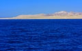 Elevated above sea level, beautiful coral reefs the form mountains and rocks against the blue sky and clear sea water coast of the Royalty Free Stock Photo