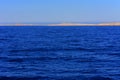 Elevated above sea level, beautiful coral reefs the form mountains and rocks against the blue sky and clear sea water coast of the Royalty Free Stock Photo