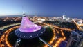 Elevated aerial view over the city center with Khan Shatyr and central business district day to night Timelapse