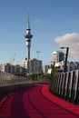 Curvy Lightpath to CBD. Urban walkway to downtown in pink color for bicycle riders. Nelson Street Cycleway, Auckland, New Zealand Royalty Free Stock Photo