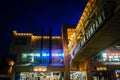 Elevated bridge and shops in Cannery Row at night, in Monterey