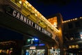 Elevated bridge and shops in Cannery Row at night, in Monterey